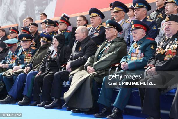 Russian President Vladimir Putin watches the Victory Day military parade at Red Square in central Moscow on May 9, 2022. - Russia celebrates the 77th...