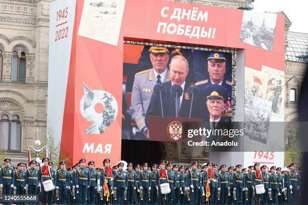 Russian President Vladimir Putin is seen on the screen as he delivers a speech during 77th anniversary of the Victory Day in Red Square in Moscow,...