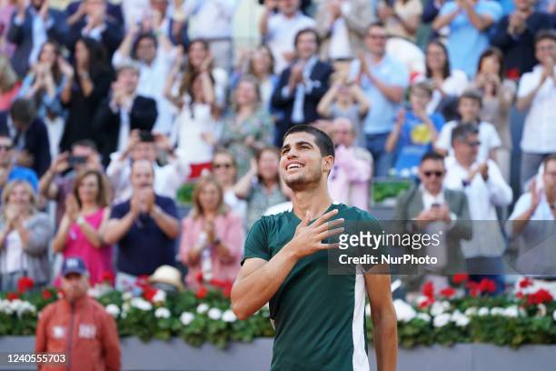 Carlos Alcaraz of Spain celebrates with the champion trophy after winning against Alexander Zverev of Germany during the Final ATP match during the...
