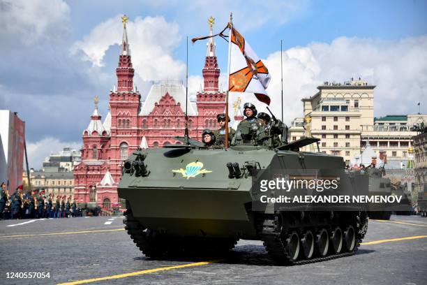 Russian servicemen, who took part in Russia's military action in Ukraine, ride BTR-MDM Rakushka airborne armored personnel carriers during the...