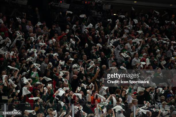 Minnesota Wild fans cheer during game 2 of the NHL playoffs between the St. Louis Blues and the Minnesota Wild on May 4th at Xcel Energy Center in...
