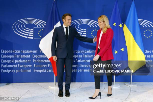 European Parliament president Roberta Metsola and France's President Emmanuel Macron pose at the EU Parliament in Strasbourg before attending the...