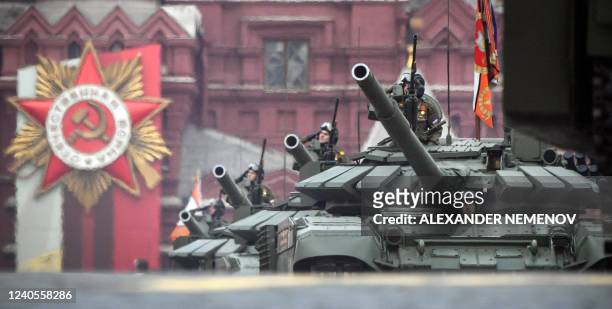 Russian T-72B3M tanks parade through Red Square during the Victory Day military parade in central Moscow on May 9, 2022. - Russia celebrates the 77th...