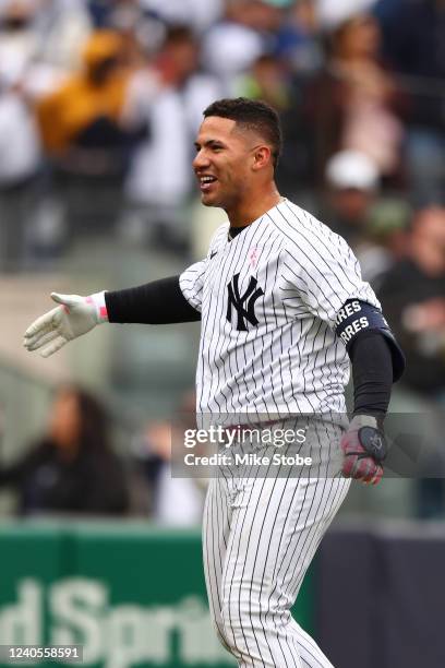 Gleyber Torres of the New York Yankees celebrates after hitting a walk-off home run in the bottom of the ninth inning to defeat the Texas Rangers 2-1...