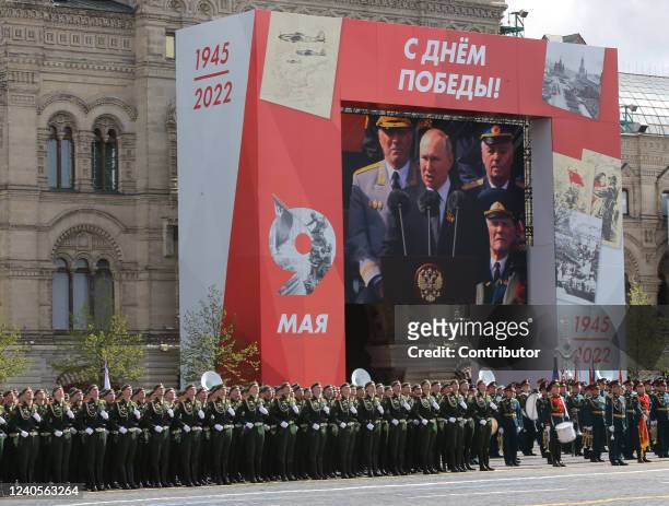 Russian President Vladimir Putin seen on the screen speacking during the Victory Day Parade at Red Square on May 9, 2022 in Moscow, Russia. The Red...