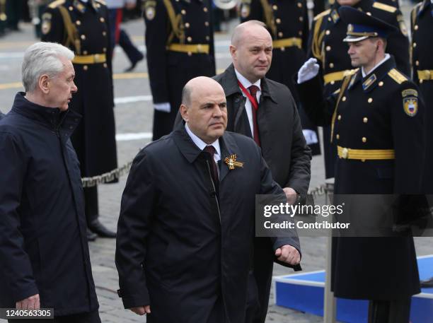 Russian Prime Minister Mikhail Mishustin and Moscow's Mayor Sergei Sobyanin seen during the Victory Day Parade at Red Square on May 9, 2022 in...