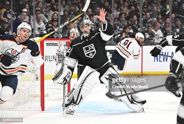 Los Angeles, California May 8, 2022-Kings goalie Jonathan Quick raises his and after losing his glove against the Oilers in the second period in Game...