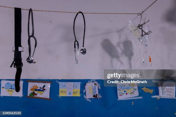 Drawings made by children and sent to Ukrainian military medics hang on the wall of a frontline field hospital on May 09, 2022 near Popasna,...