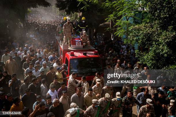 Mourners and soldiers accompany the casket of Egyptian First Lieutenant Soleman Ali Soleman, one of 11 soldiers killed in an attack claimed by the...