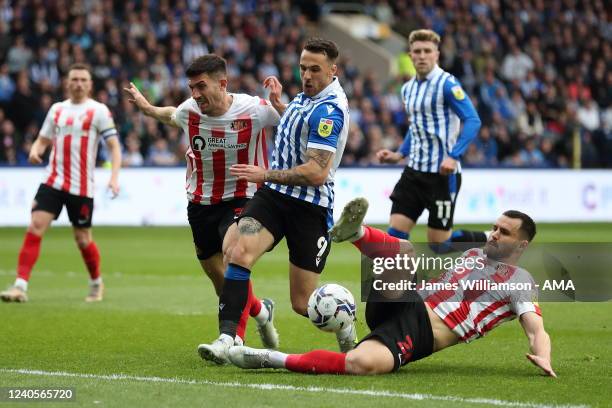 Lee Gregory of Sheffield Wednesday and Bailey Wright of Sunderland during the Sky Bet League One Play-Off Semi Final 2nd Leg match between Sheffield...