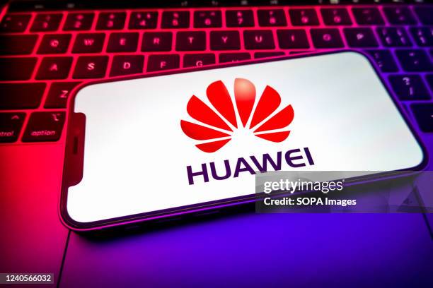 In this photo illustration, a Huawei Investment & Holding logo seen displayed on a smartphone screen.