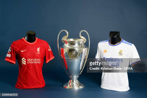 View of the Liverpool FC and Real Madrid CF jerseys with the UEFA Champions League trophy during the UEFA Champions League Final 2021/22 Jerseys...