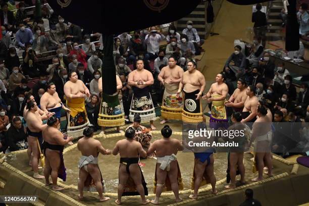 Rikishis of high position, wearing their emblems, attends a ceremony prior the start of the competition in their category at Tokyo's Ryogoku...