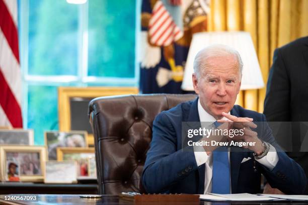 President Joe Biden speaks to reporters before signing the Ukraine Democracy Defense Lend-Lease Act of 2022 in the Oval Office of the White House May...