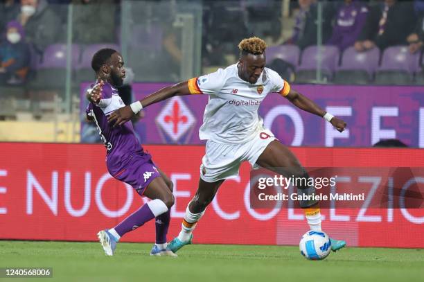 Tammy Abraham of AS Roma battles for the ball with Nanitamo Jonathan Ikoné of ACF Fiorentina during the Serie A match between ACF Fiorentina and AS...