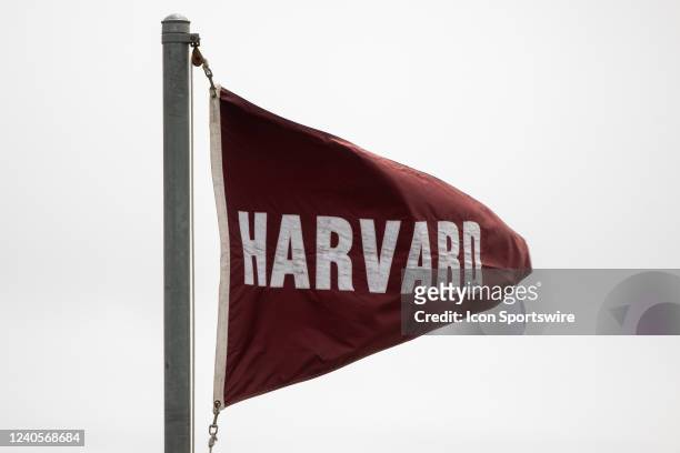 Harvard Crimson flag waves in the wind during the Ivy League Tournament championship college lacrosse game between the Pennsylvania Quakers and the...