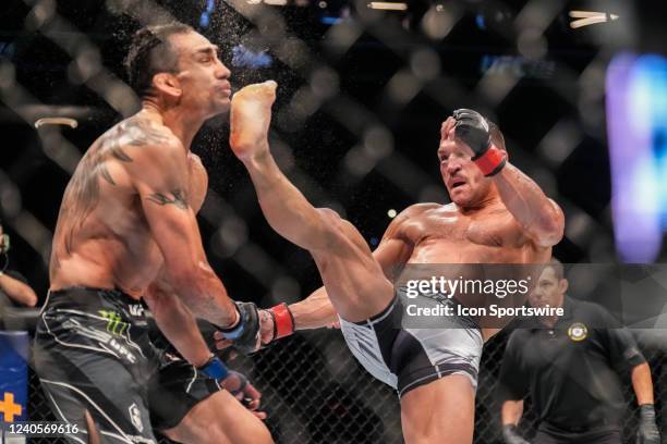 Michael Chandler knocks out Tony Ferguson with a front kick in their Lightweight bout during the UFC 274 event at Footprint Center on May 7 in...