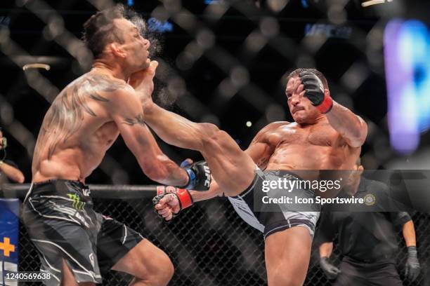 Michael Chandler knocks out Tony Ferguson with a front kick in their Lightweight bout during the UFC 274 event at Footprint Center on May 7 in...