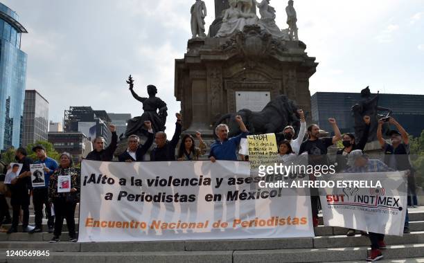 Members of the press and relatives attend a protest against the murder of journalists in the framework of the National Meeting of Journalists, at the...