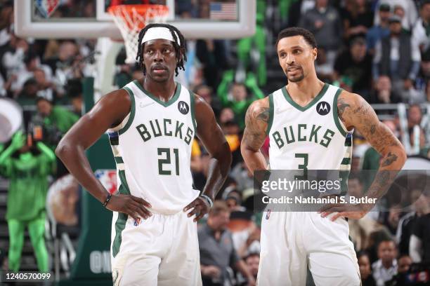 Jrue Holiday of the Milwaukee Bucks and George Hill of the Milwaukee Bucks look on during Game 4 of the 2022 NBA Playoffs Eastern Conference...