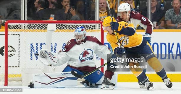 Nick Cousins of the Nashville Predators battles in front of the net against Erik Johnson and Pavel Francouz of the Colorado Avalanche in Game Four of...