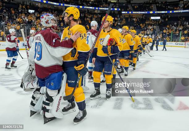 Roman Josi of the Nashville Predators shakes hands with goalie Pavel Francouz of the Colorado Avalanche after a 5-3 loss in Game Four of the First...