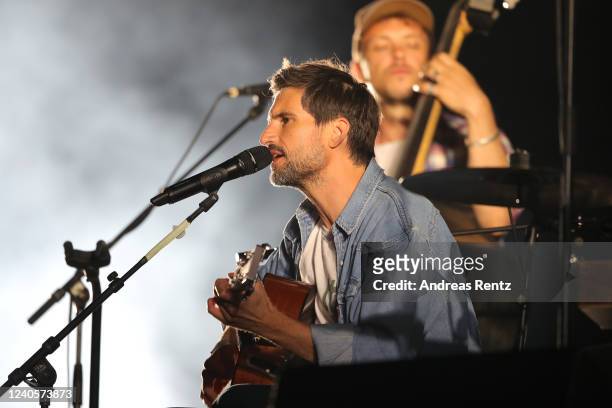 German singer and actor Tom Beck performs on stage at drive-in Autokino Dusseldorf during the Coronavirus crisis on June 01, 2020 in Dusseldorf,...