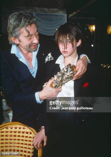 Charlotte Gainsbourg and her father Serge Gainsbourg at Fouquets, after the César award ceremony during which Charlotte won an award for Most...
