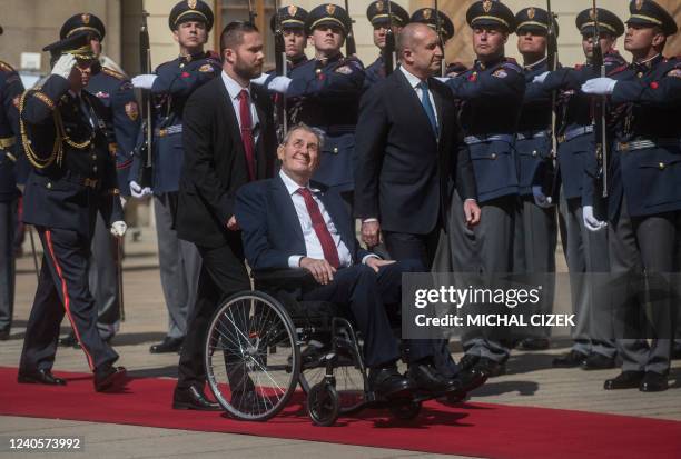 Bulgaria's President Rumen Radev and Czech President Milos Zeman review an honour guard during a welcoming ceremony at the start of their meeting on...