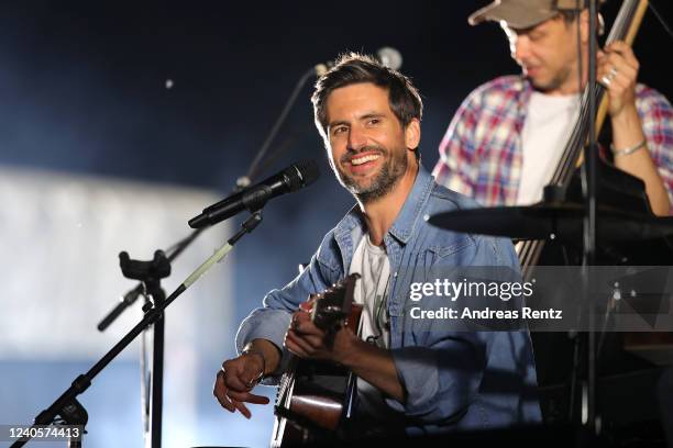 German singer and actor Tom Beck performs on stage at drive-in Autokino Dusseldorf during the Coronavirus crisis on June 01, 2020 in Dusseldorf,...