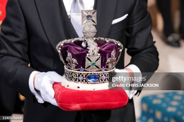 The Imperial State Crown arrives through the Sovereign's Entrance ahead of the State Opening of Parliament at the Houses of Parliament, in London, on...
