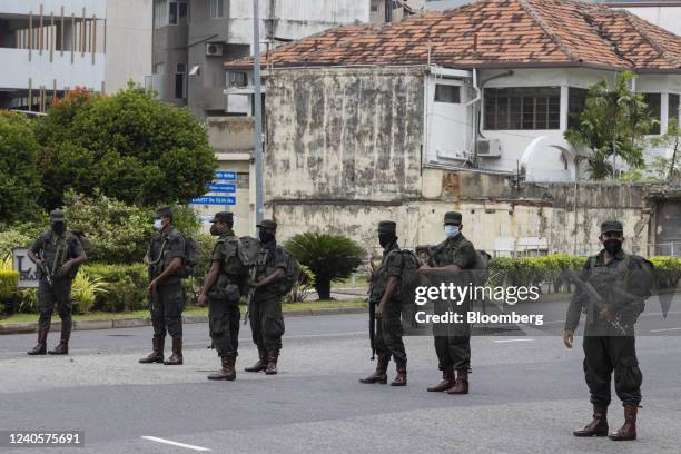 Sri Lankan army officers block as street at a security check point in Colombo, Sri Lanka, on Tuesday, May 10, 2022. Violence erupted in Sri Lanka on...