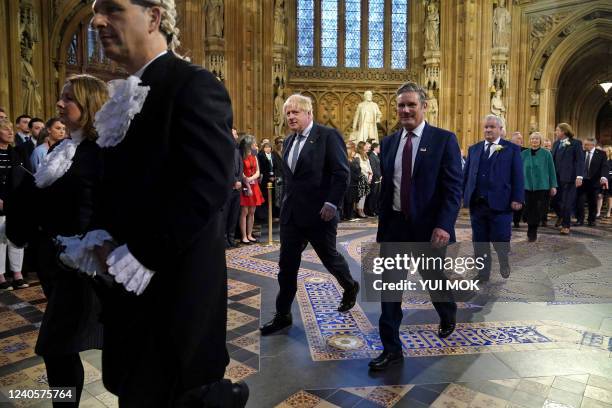 Britain's Prime Minister Boris Johnson and Britain's main opposition Labour Party leader Keir Starmer walk through the Central Lobby at the Palace of...