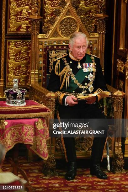 Britain's Prince Charles, Prince of Wales sits by the The Imperial State Crown in the House of Lords Chamber during the State Opening of Parliament...