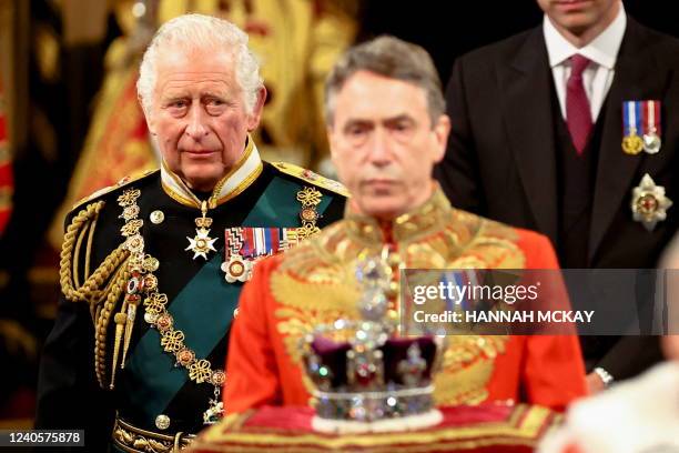 Britain's Prince Charles, Prince of Wales proceeds behind the Imperial State Crown through the Royal Gallery during the State Opening of Parliament...