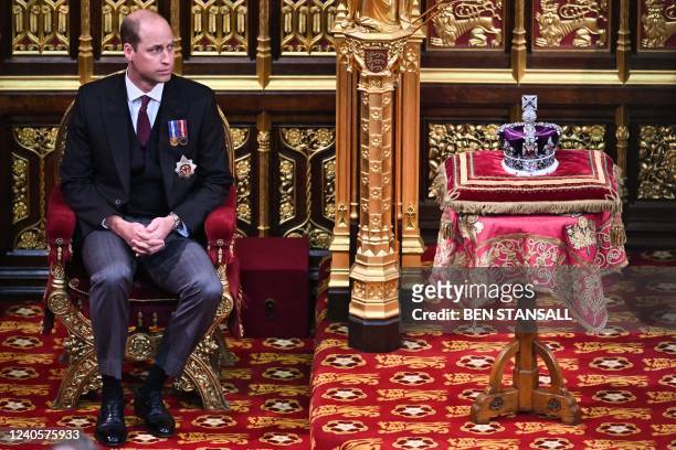 Britain's Prince William, Duke of Cambridge, sits by the Imperial State Crown, in the House of Lords chamber, during the State Opening of Parliament,...