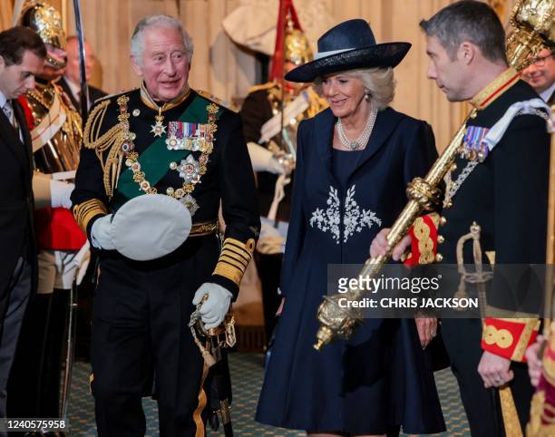 Britain's Prince Charles, Prince of Wales and Britain's Camilla, Duchess of Cornwall depart through the Sovereign's Entrance after attending the...