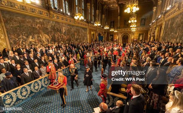 Prince Charles, Prince of Wales processes along the Royal gallery with Camilla, Duchess of Cornwall and Prince William, Duke of Cambridge during the...