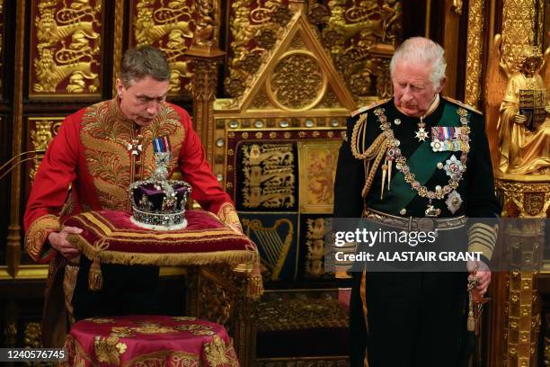 Britain's Prince Charles, Prince of Wales looks on as the The Imperial State Crown is placed beside him in the House of Lords Chamber during the...