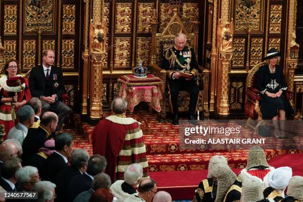 Britain's Prince Charles, Prince of Wales sits by the The Imperial State Crown with Britain's Camilla, Duchess of Cornwall and Britain's Prince...