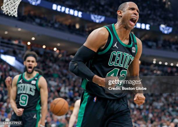 The Celtics Al Horford howls after he dunked on the Bucks Giannis Antetokounmpo in the fourth quarter to tie the game at 80-80. He was fouled on the...