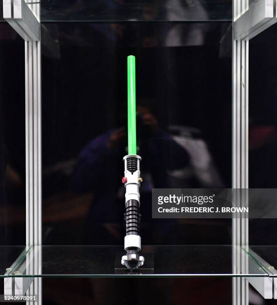 Obi-Wan Kenobi's Lightsaber hilt with short blade from the 1999 film "Star Wars: The Phantom Menace" is displayed at Propstore on May 9, 2022 in...