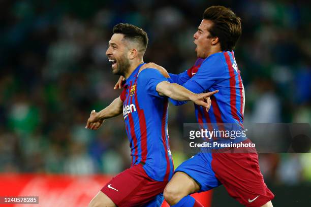Jordi Alba of FC Barcelona celebrates after scoring goal with his teammate Riqui Puig during the La Liga match between Real Betis and FC Barcelona...