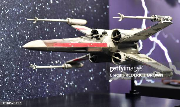 Photomatched 1976 Pyro X-Wing Starfighter model miniature from the 1977 film "Star Wars: A New Hope" is displayed at Propstore in Valencia,...