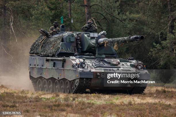 Soldiers of the Bundeswehr, the German armed forces, participate with the Panzerhaubitze 2000 - the Pzh 2000 self-propelled howitzer in the Wettiner...