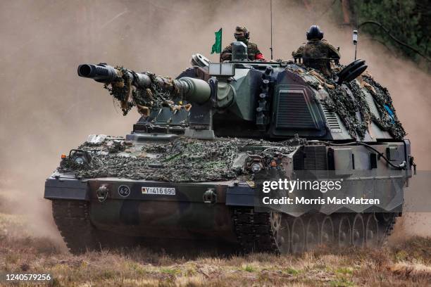 Soldiers of the Bundeswehr, the German armed forces, participate with the Panzerhaubitze 2000 - the Pzh 2000 self-propelled howitzer in the Wettiner...