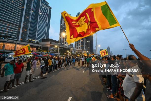 Anti-government demonstrators take part in a protest near the President's office in Colombo on May 10, 2022. - Fresh protests erupted in Sri Lanka's...