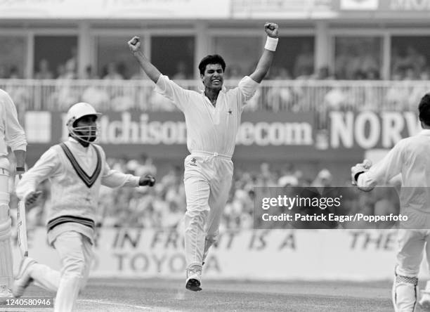 Waqar Younis of Pakistan celebrates the wicket of England captain Graham Gooch, caught for 24 runs, on day three of the 5th Test match between...