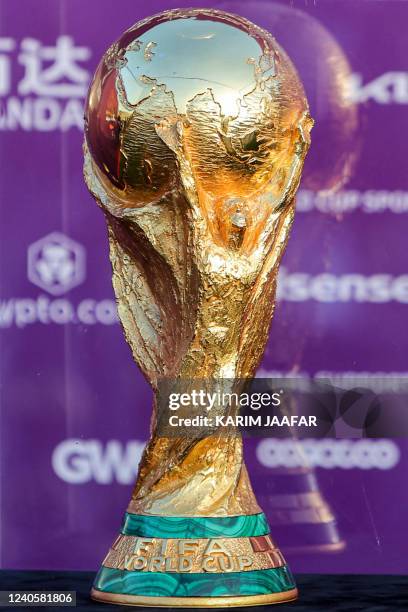 This picture taken on May 10, 2022 shows a view of the FIFA World Cup Trophy while on display at the Katara cultural village in Qatar's capital Doha.