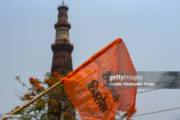 Members of Hindu organisations carry flags and recite Hanuman Chalisa outside the Qutub Minar demanding to rename the monument as 'Vishnu Stambh' on...